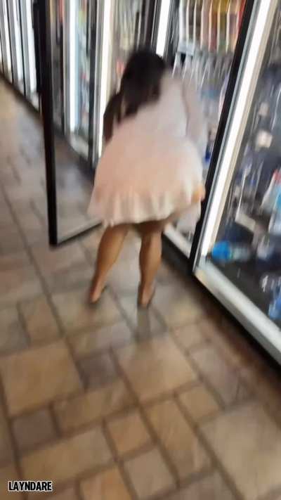 When you thought her tits were mostly visible thru her top she bends over and shows her bare pussy!