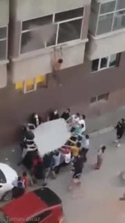 Group saves a man from burning apartment.
