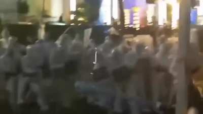 Chinese citizens are fighting in the streets against government workers in protective suits who are supposed to enforce China's zero covid policy