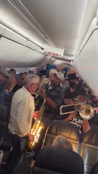 Flight delays had everyone restless&hellip; until a band turned the plane into a concert hall
