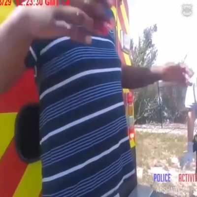A man who was rescued after crashing his car into a lake grabbed an officer's taser after refusing medical treatment.