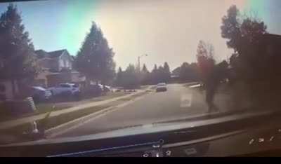 A man pushes his own child into a moving car in Missisauga, CA to apparently &ldquo;prove a point&rdquo; that pedestrians have the right of way on residential streets.