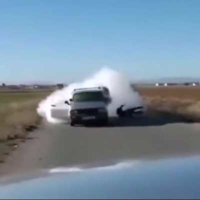 A guy tries to shoots an &ldquo;RPG&rdquo; in the back of a car, but it back fires... ( it doesn&rsquo;t look like an rpg but idk)