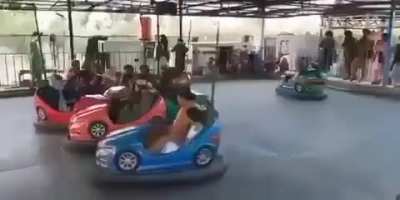 Taliban playing bumper cars after taking control of a theme park in Kabul.