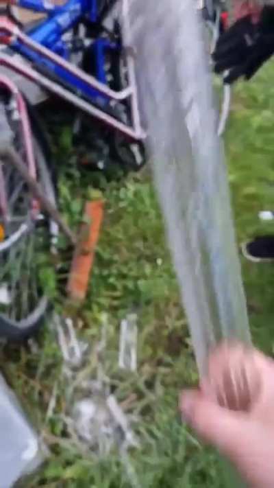 Man Pulls Frozen Water Stick From Pipe.