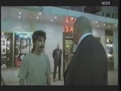 German pimp slaps guy while doing an interview for TV.