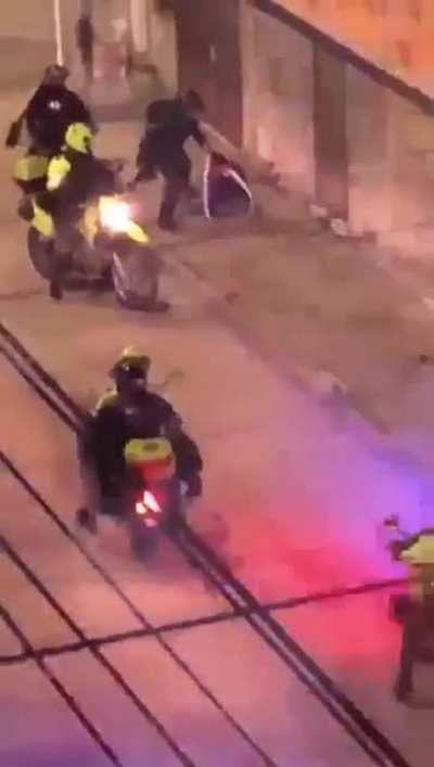 Police attack a passing man. Silo&eacute;, Cali. May 4th 2021.