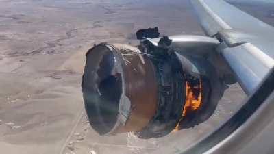 Flight #UA328 engine failure as seen from the cabin. The plane has returned to Denver intl. and landed safely