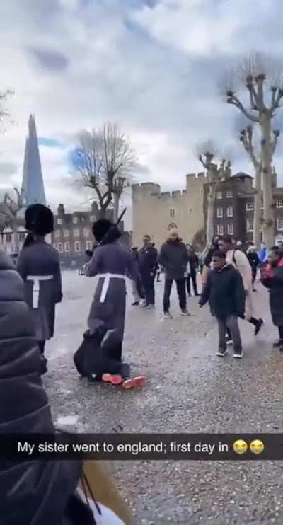 royal guards walk over a kid