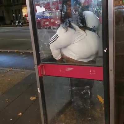 Shitting in a phone box