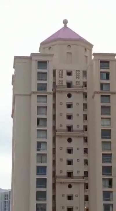 Kid walks around her building three times for a 