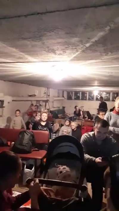 A girl sing a song in a shelter