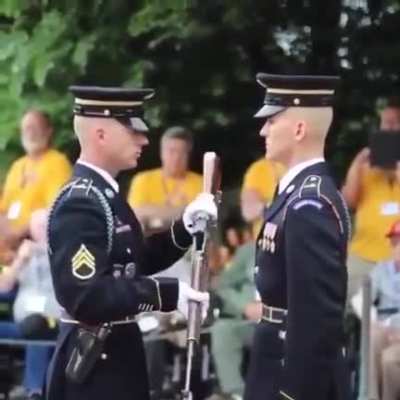 Inspecting a rifle.
