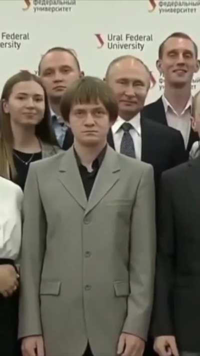 to stand in front of Putin for a photo