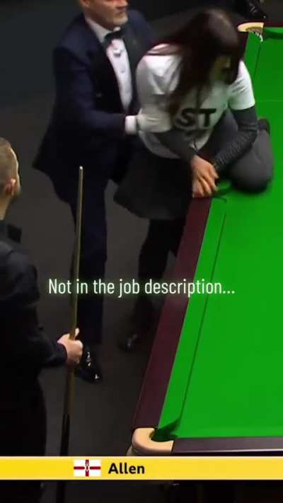 Referee stops protester from climbing onto snooker table