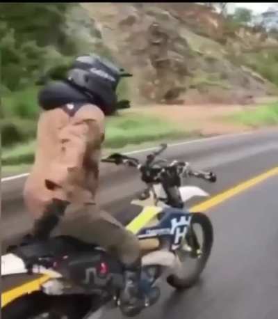 Slapping ass while riding a dirt bike on slippery road