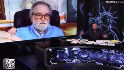 MAGA con man Alex Jones has another MAGA con man on his show who says: "I met Jesus in my bedroom, and Satan sent the globalist lawyers to sue Alex. This is a setup! Help Alex. Send him your money!"