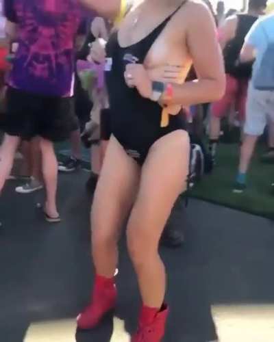 Girl sprays breast milk on people at a festival