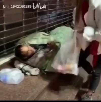 Look how good I am feeding the homeless. Let&rsquo;s wake him up for views