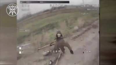 A Russian soldier tries to fight off a Ukrainian FPV quad with his crutches. Donetsk Oblast.