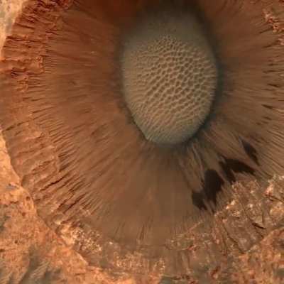 A 1-mile-wide (1.5km) impact crater on Mars, captured by the HiRISE camera on the Mars Reconnaissance Orbiter from 160 miles (257 km) above the planets surface.