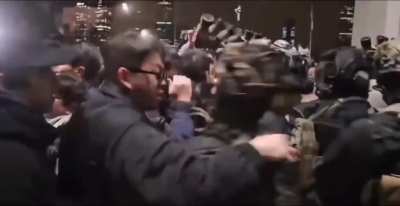 A man tried to steal the South Korean soldier's helmet accessories during the brawl