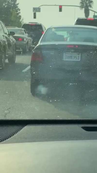Car making smoke rings in front of me