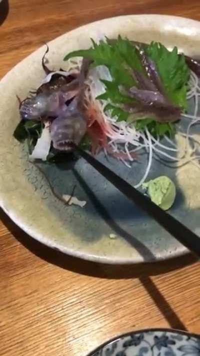 Eating fish at a restaurant
