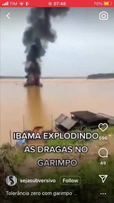 Illegal gold miners and their families react as Brazil’s environmental protection institute destroys their unregulated river mining dredge