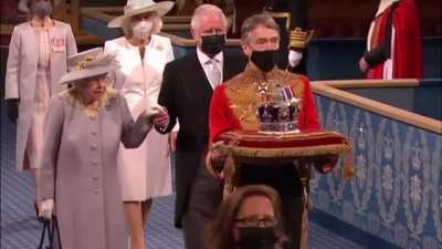 BBC's comments on North Korea overlaid on Lizzy's funeral procession