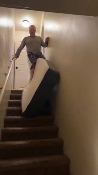 Riding a mattress down the stairs