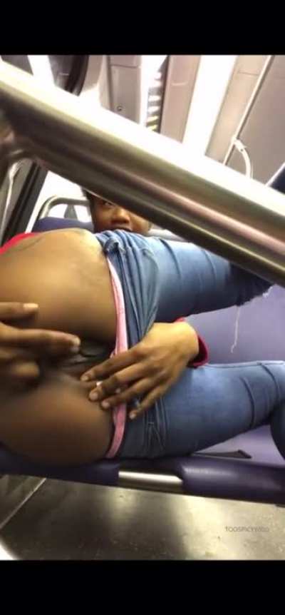 Ebony girl masturbating on train