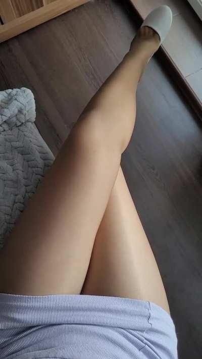 Glossy tights and white flats.