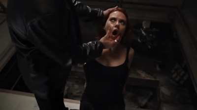 Scarlett Johansson tied to a chair in the movie avengers 2012