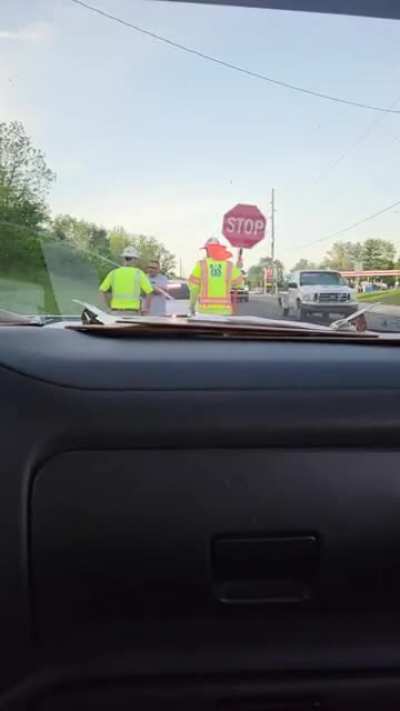 Unhinged off duty officer trys to bully and intimidate road construction crew