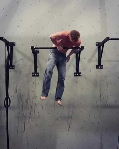 One arm muscle up by rock climber Magnus Midtb&oslash;