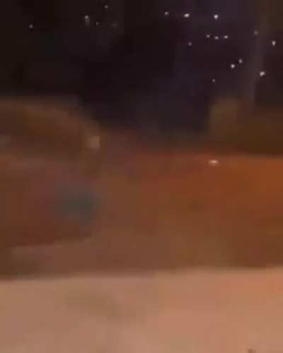 Kid uses handheld firework like a magic wand