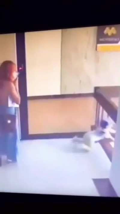 Women saving small child's life from falling.