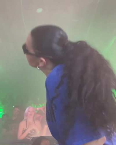 front row view of Charli XCX shaking her ass