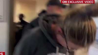 Video of Ethan Crumbley's parents being escorted from the basement of a studio in handcuffs after getting caught.