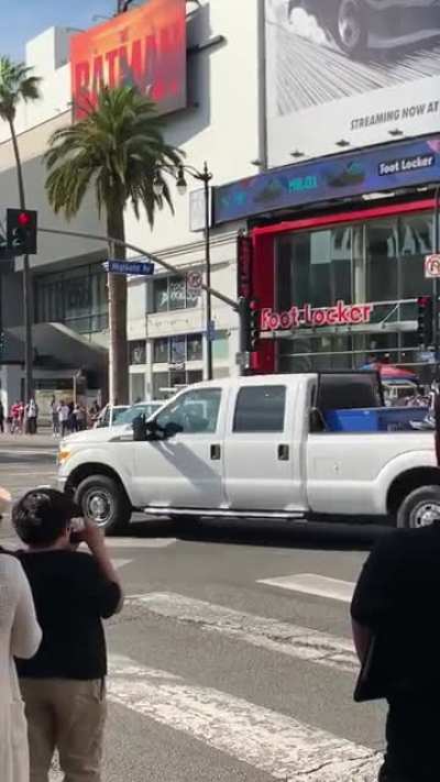 Guy in Hollywood cleans his truck.
