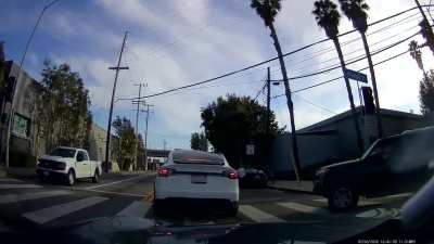 Driver fails to yield at green light, stops traffic to argue [oc]