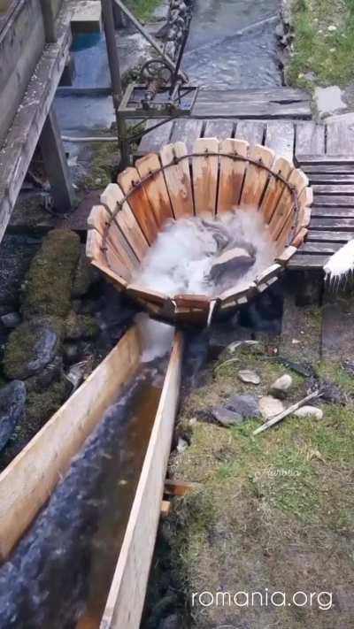 Traditional mechanism (v&acirc;ltori) for washing clothes under running water from a river in Romania