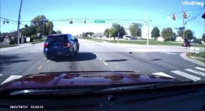 Car pulls up to the accident with the suspect