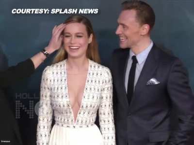 Brie Larson catches Tom Hiddleston staring at her cleavage.