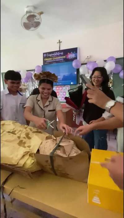 Students gave their teacher a roasted pig (lechon baboy a famous food in Philippines) as a gift on Teacher's Day