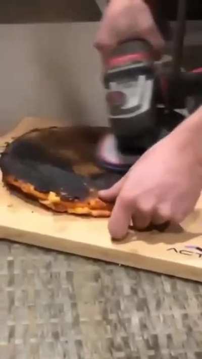 Dude prepares a pizza