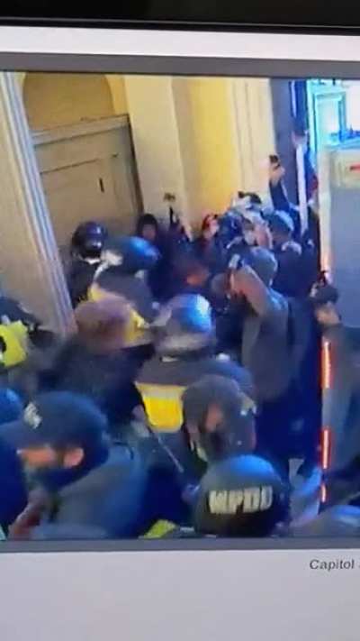 Capitol Police officer gets shoved.. shakes it off - and throws a mean left hook to rioter's face