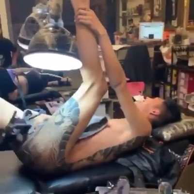 Guy gets an ass tattoo and can't handle the pain