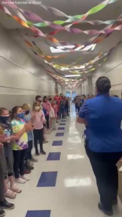 Students and staff at an Oklahoma elementary school lined the hallways to cheer for their school cafeteria manager who passed her test to become a U.S. citizen